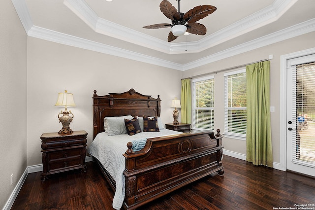 bedroom with access to outside, ceiling fan, a tray ceiling, and crown molding