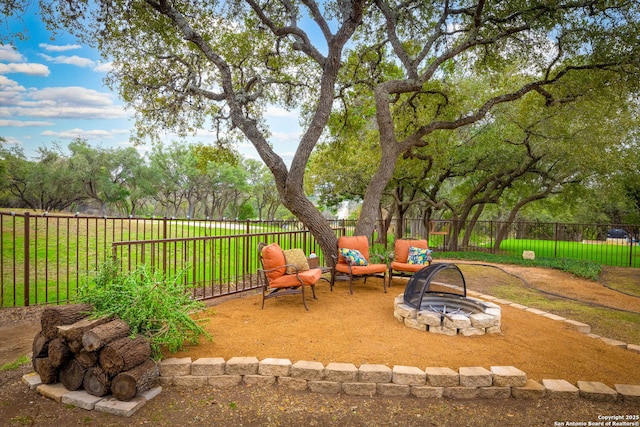 view of patio with a fire pit