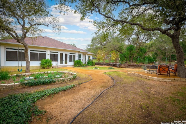 view of yard featuring a fire pit