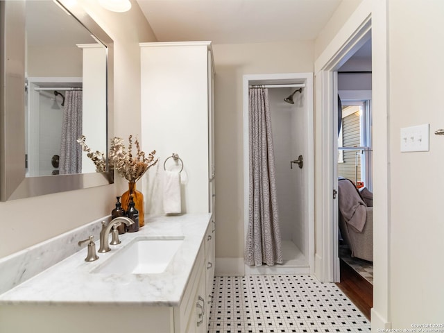 bathroom with a shower with curtain and vanity