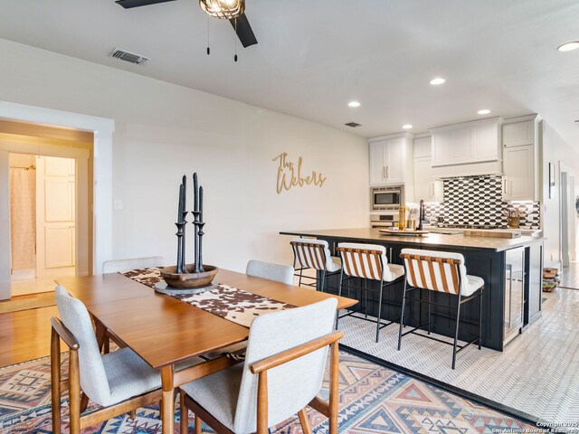 dining space featuring ceiling fan