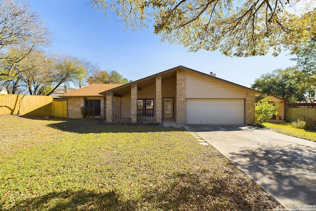 ranch-style home featuring a front lawn and a garage