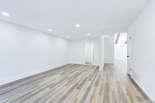 spare room featuring light hardwood / wood-style floors