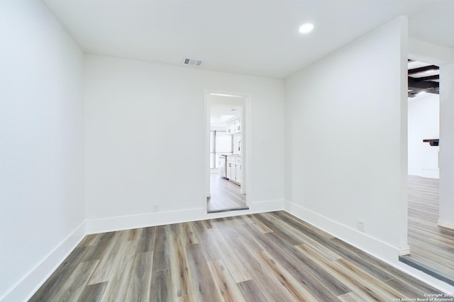 unfurnished room featuring light wood-type flooring