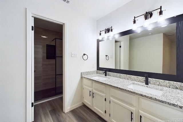 bathroom with wood-type flooring and vanity