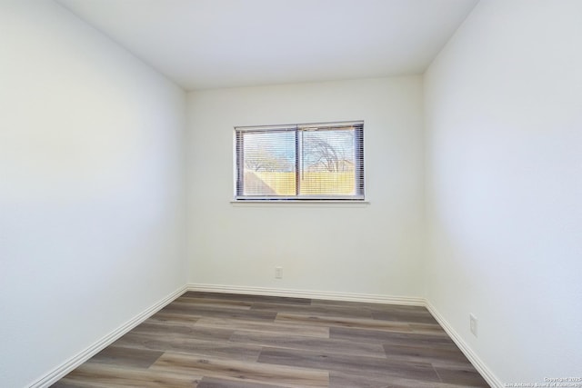 spare room featuring dark hardwood / wood-style floors