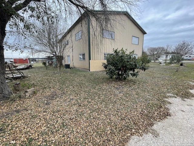 view of side of home featuring cooling unit