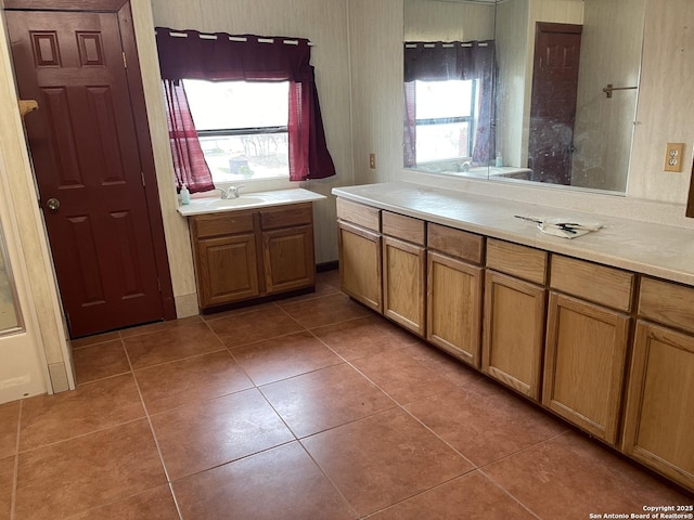 bathroom with tile patterned floors and sink