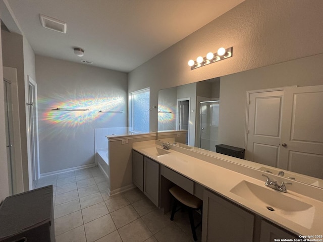 bathroom featuring shower with separate bathtub, vanity, and tile patterned floors