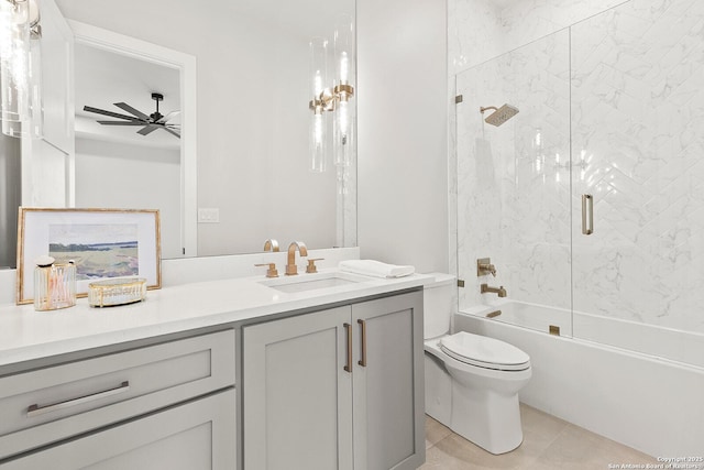 full bathroom with toilet, vanity, ceiling fan, tile patterned floors, and enclosed tub / shower combo