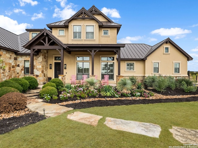 view of front facade featuring a front yard and a porch