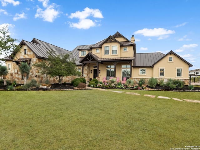 craftsman house featuring a porch and a front lawn