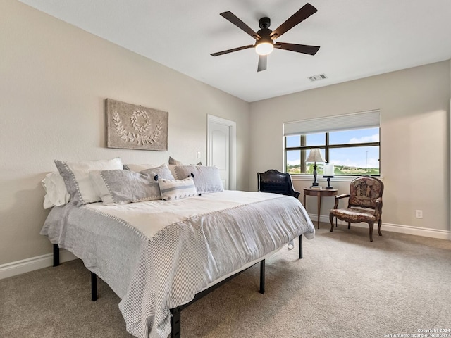 carpeted bedroom featuring ceiling fan