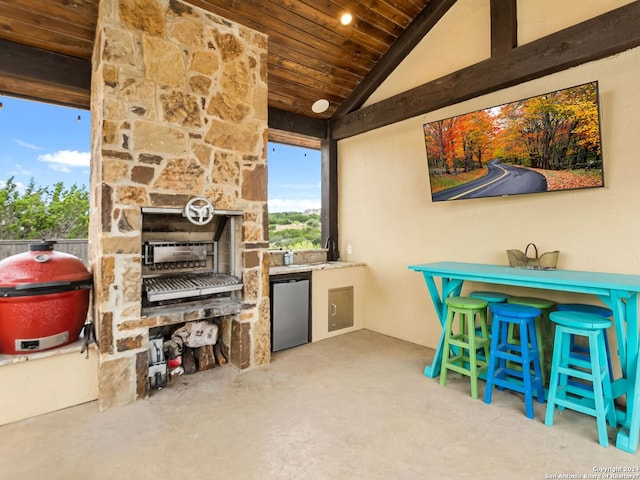 view of patio / terrace with an outdoor bar, area for grilling, and grilling area