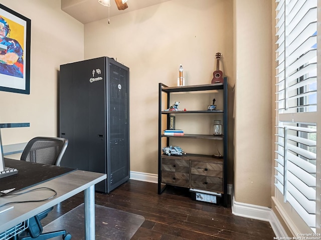 office with dark hardwood / wood-style flooring and ceiling fan