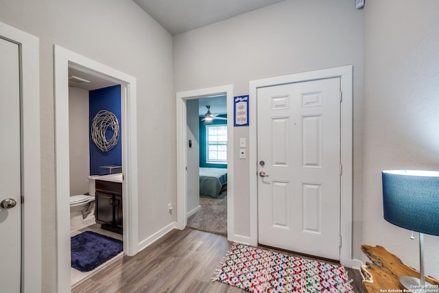 entrance foyer with ceiling fan and light wood-type flooring