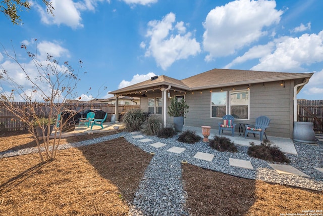 back of house with a patio