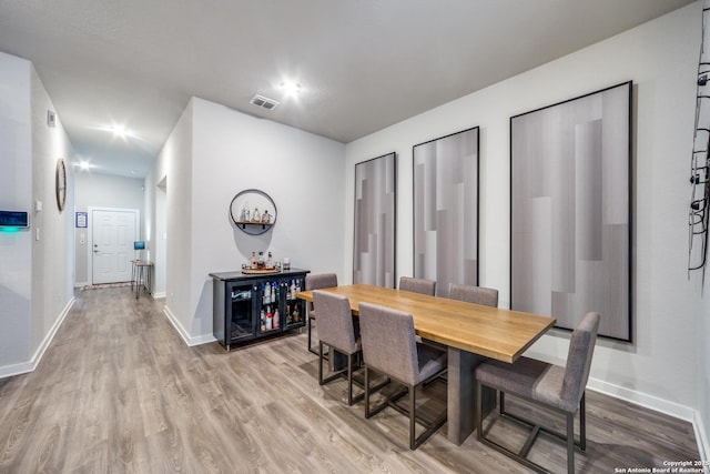 dining area featuring light wood-type flooring