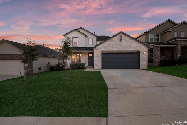 view of front facade featuring a yard and a garage