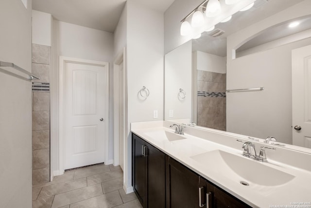 bathroom with tile patterned flooring and vanity