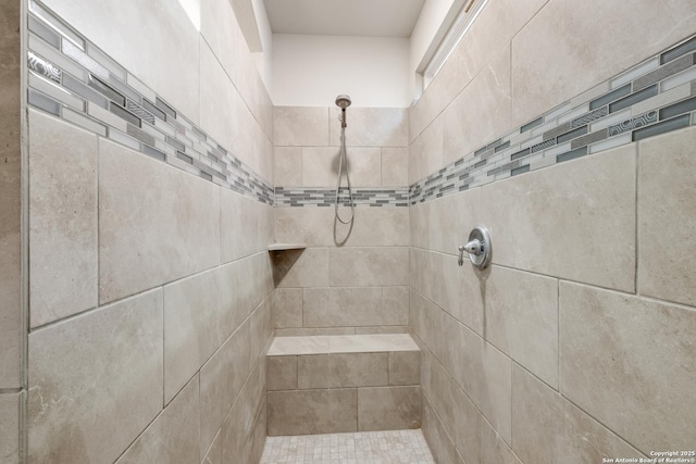 bathroom with tiled shower