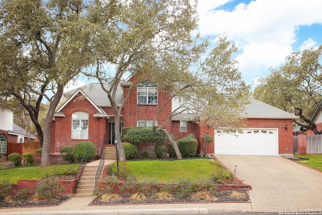 view of property with a front lawn and a garage