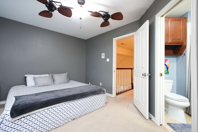 carpeted bedroom with ceiling fan and connected bathroom