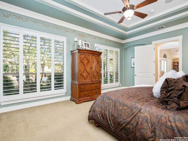 carpeted bedroom featuring ceiling fan and crown molding