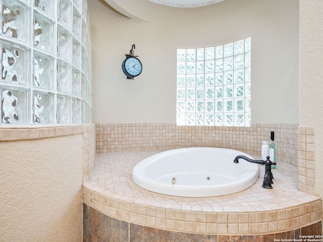 bathroom featuring tiled bath