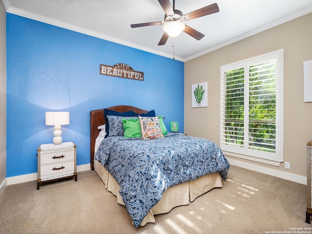 carpeted bedroom featuring ornamental molding and ceiling fan