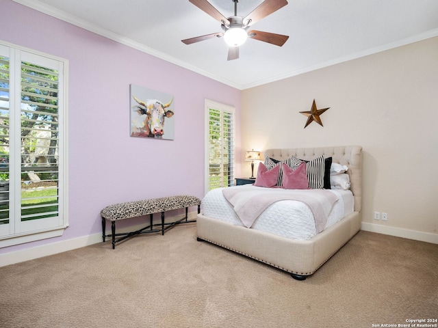 bedroom with ornamental molding, ceiling fan, and carpet flooring