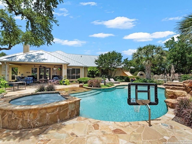 view of swimming pool featuring ceiling fan, an in ground hot tub, and a patio area