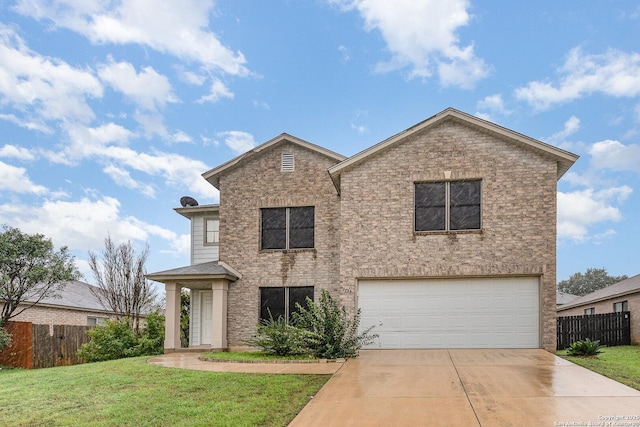 view of front property featuring a front lawn and a garage