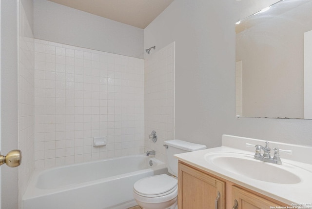 full bathroom featuring tub / shower combination, vanity, and toilet