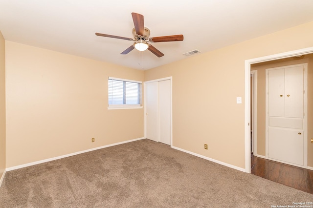 unfurnished bedroom with carpet floors and ceiling fan