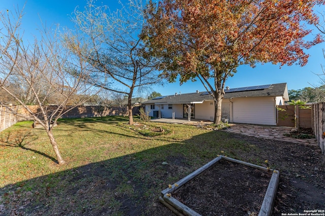 exterior space with a front yard and a patio