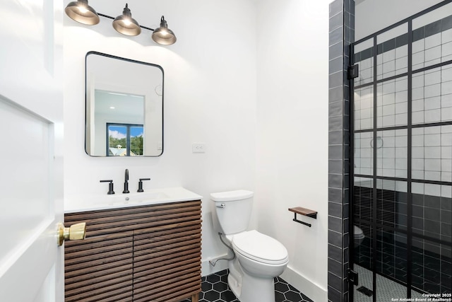 bathroom with toilet, a tile shower, tile patterned floors, and vanity