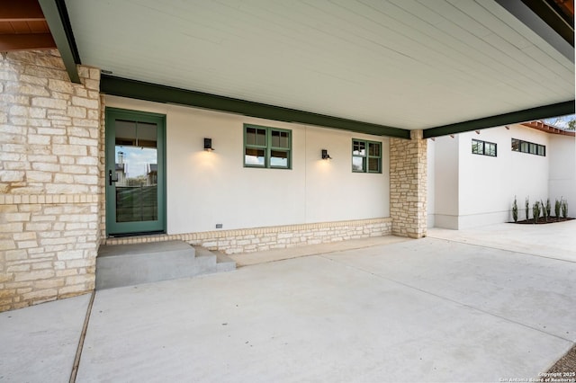 entrance to property with a patio