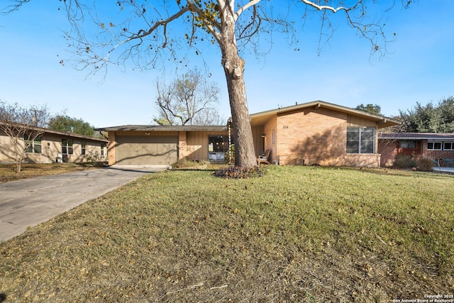 single story home with a front yard and a garage