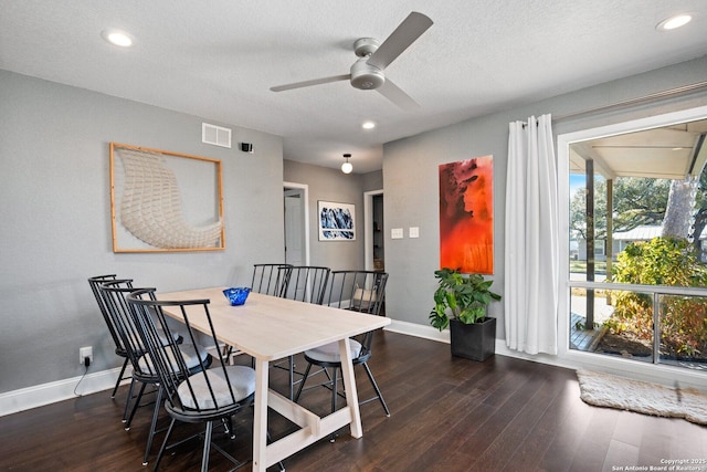 dining space with a textured ceiling, ceiling fan, a wealth of natural light, and dark hardwood / wood-style floors