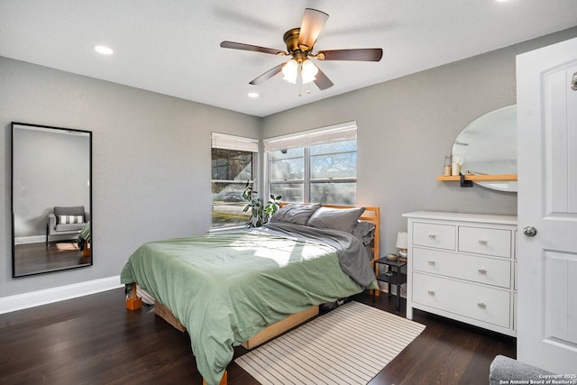 bedroom featuring ceiling fan and dark hardwood / wood-style floors