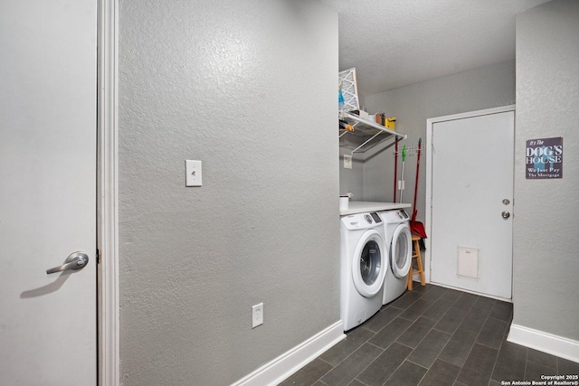 laundry area featuring washing machine and clothes dryer