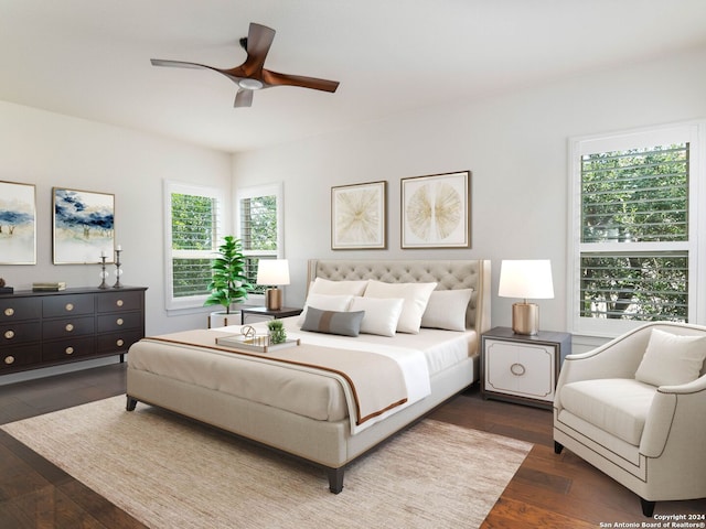 bedroom with ceiling fan and dark hardwood / wood-style flooring