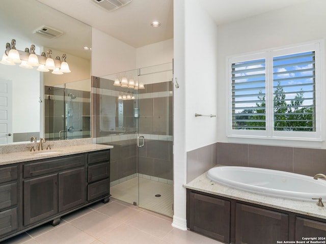 bathroom with vanity, shower with separate bathtub, and tile patterned flooring