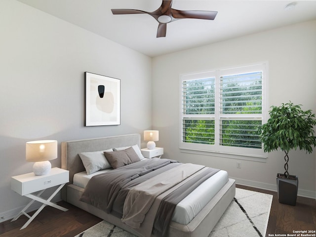 bedroom with ceiling fan and hardwood / wood-style flooring