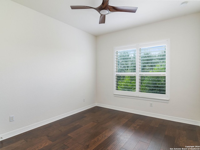 spare room with ceiling fan and dark hardwood / wood-style flooring