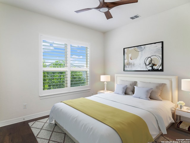 bedroom with ceiling fan and hardwood / wood-style floors