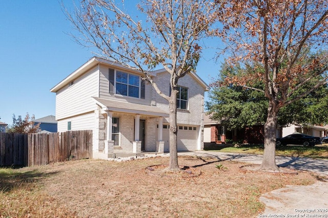 view of front of house with a garage and a porch