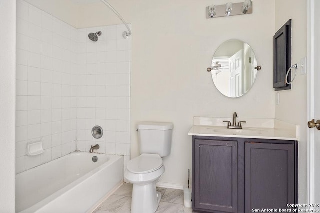 full bathroom with toilet, tiled shower / bath combo, and vanity