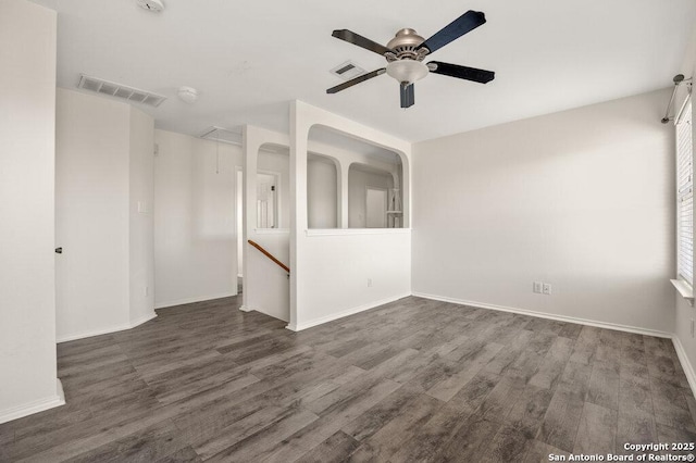 unfurnished room featuring ceiling fan and dark hardwood / wood-style floors